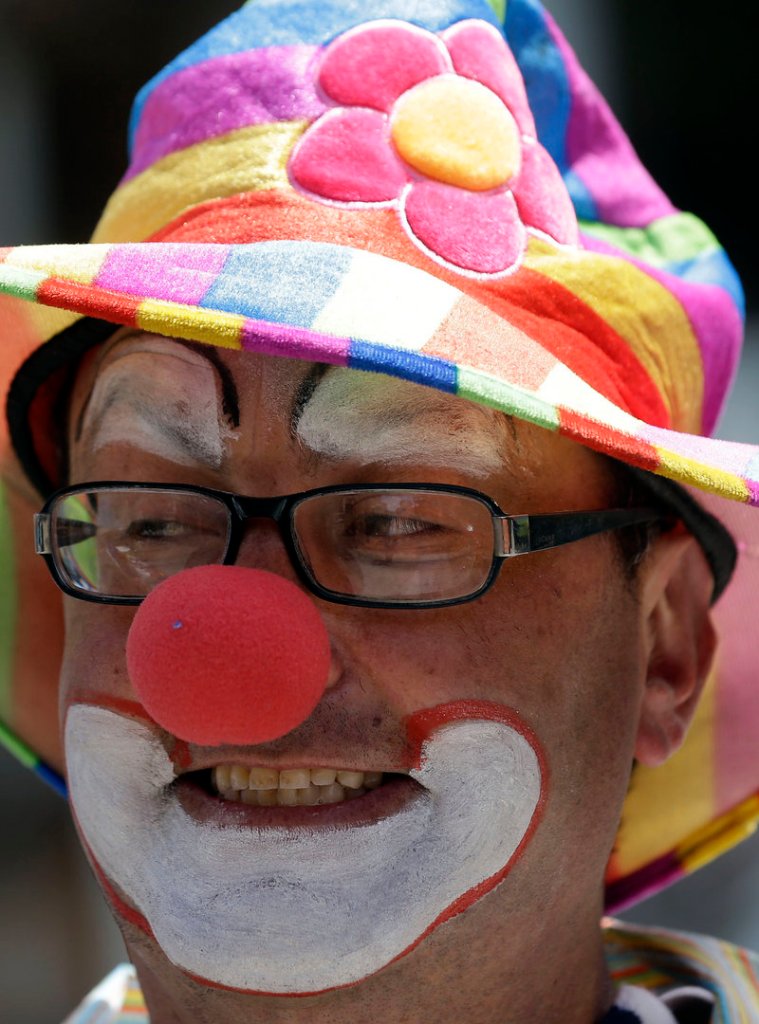 Kenny the Clown, the professional entertainer otherwise known as Kenneth Kahn, smiles as he performs in San Francisco on Friday.