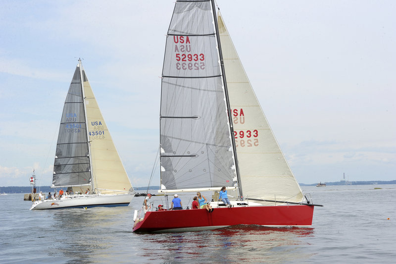 Family Wagon, with the red hull, leads Beausoleil during the racing division 1 start in the 31st annual MS Harborfest Regatta in Portland Harbor on Saturday.