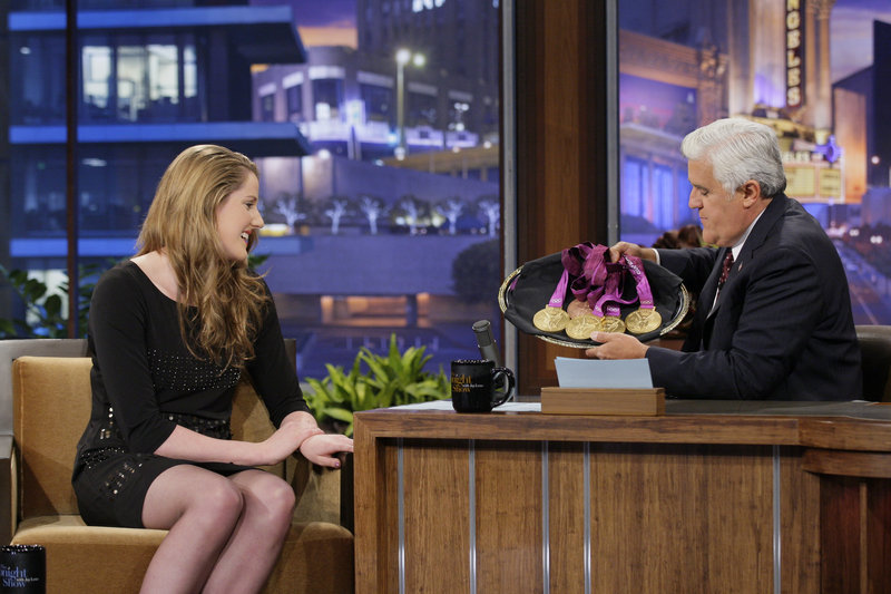 Olympic swimmer Missy Franklin and Jay Leno tape “The Tonight Show” on Wednesday in Burbank, Calif. His current salary is $25 million to $30 million. His new salary will likely be around $20 million, a source says. NBC is under pressure from parent Comcast Corp. to cut costs.