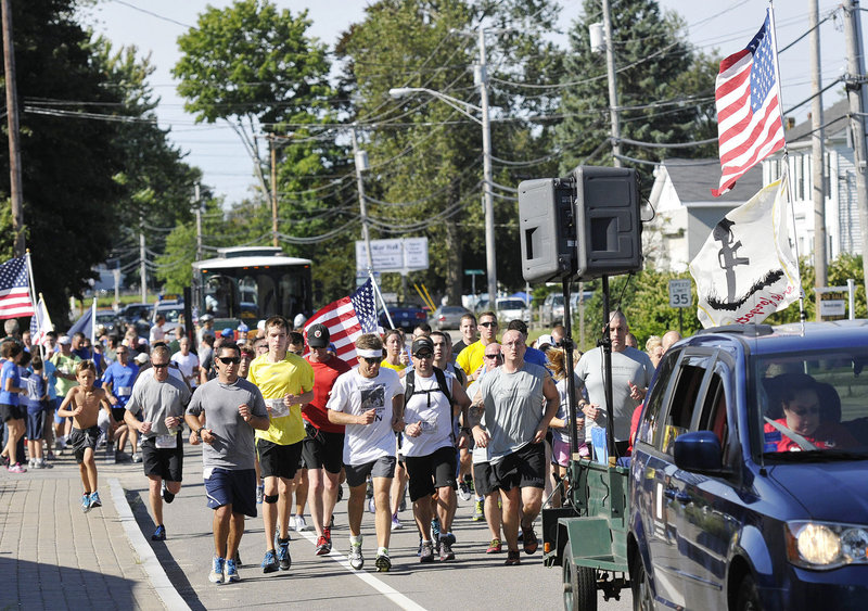Runners participating in the fifth Run for the Fallen make their way up Route 1 in Wells on Sunday. The 65-kilometer course stretches from Ogunquit to Portland.