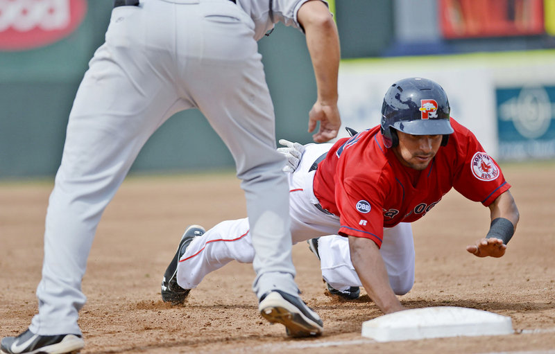 Ryan Dent dives safely back to first base as New Britain’s Chris Colabello fields the pickoff attempt. The Sea Dogs wrapped up a 5-1 homestand and improved to 18-5 at Hadlock Field since the Eastern League All-Star break.