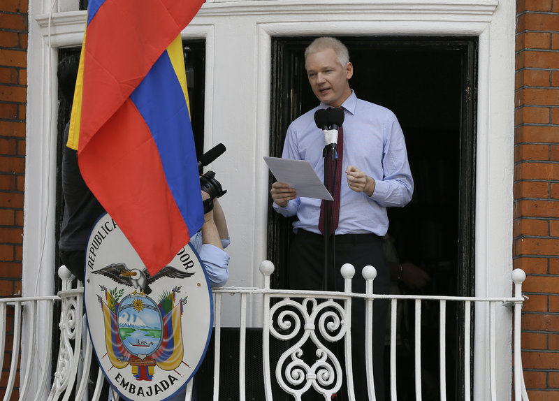 Julian Assange, founder of WikiLeaks, issues a statement Sunday from a balcony of the Ecuadorean Embassy in London. He accused the U.S. of targeting him for revealing secrets.