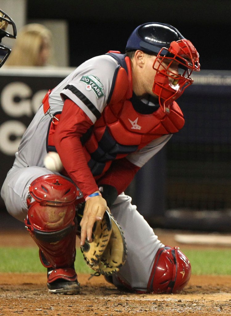 Red Sox catcher Ryan Lavarnway can’t block a wild pitch by Josh Beckett, allowing Derek Jeter to score from third base.