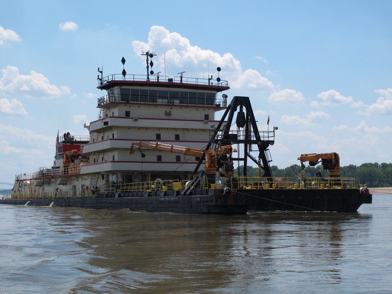 An Army Corps of Engineers’ dredge works to clear a navigation channel Monday on the Mississippi near Memphis, Tenn. An 11-mile stretch is closed near Greenville, Miss.