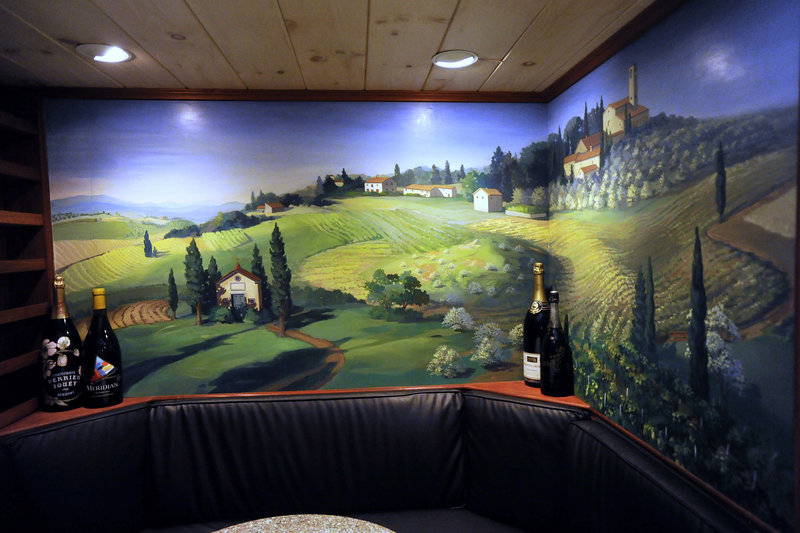 Patrons dining in the wine cellar at the White Barn Inn can admire a mural of Tuscany painted by local artist Judith Hardenbrook.
