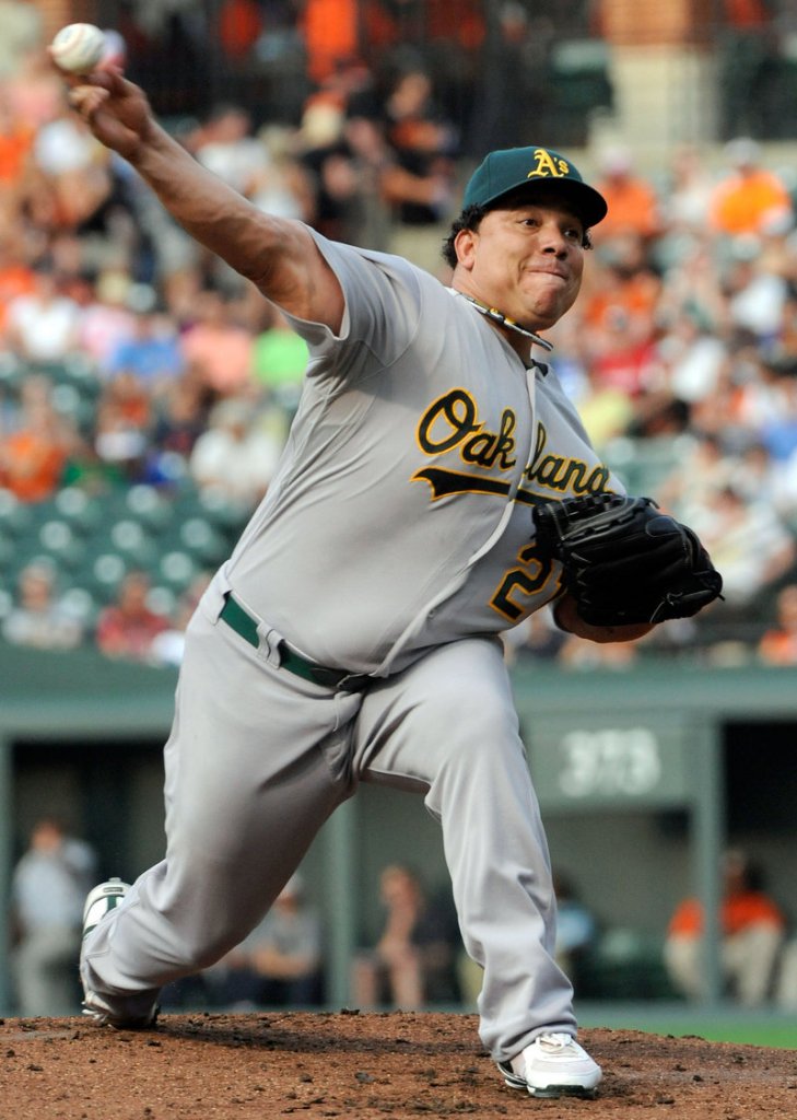 Bartolo Colon, the Oakland Athletics’ pitcher who won the 2005 Cy Young Award, is suspended after testing positive for testosterone.