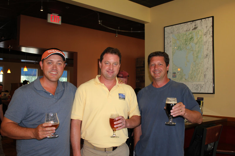 Founders of Sebago Brewing Company, from left, Kai Adams, Brad Monarch and Tim Haines, at the event held at their Scarborough restaurant.