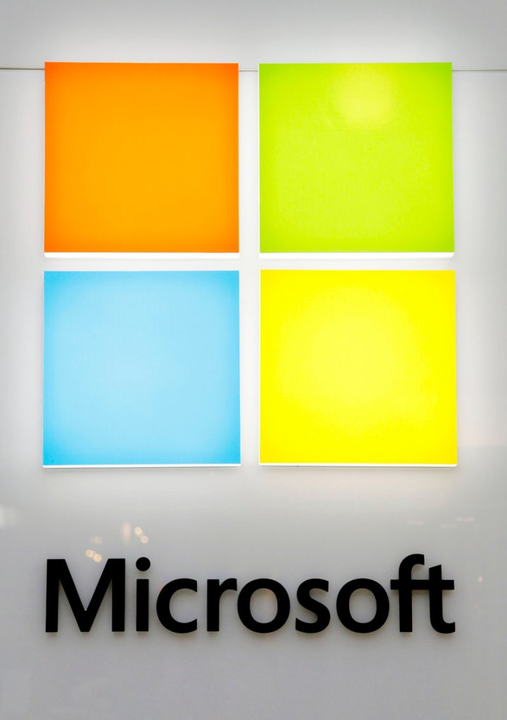 A new Microsoft logo is seen on a wall of a newly opened Microsoft store in Boston on Thursday. The new logo marks the first time that Microsoft Corp. has revamped its logo in 25 years.