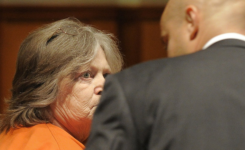 Carol Field, 66, of Standish, listens to J.P. DeGrinney, her court-appointed attorney, before pleading guilty to six counts of arson Thursday in Cumberland County Unified Criminal Court.
