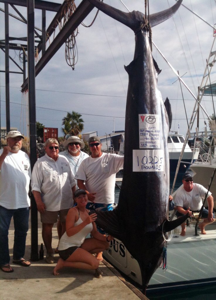 Molly Palmer poses with her crew and her catch, a 12-foot marlin that took more than four hours to land.