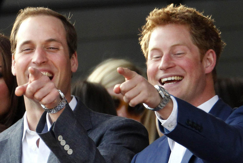 The Duke of Cambridge and his brother, Prince Harry, right, attend a concert in London on June 4. TMZ and The Sun have published nude photos of Harry.