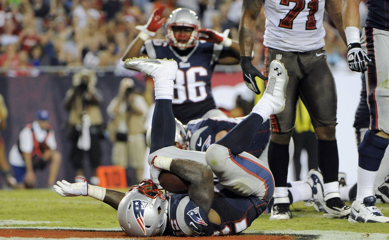 New England’s Stevan Ridley tumbles into the end zone after his touchdown run in a 30-28 exhibition loss at the Tampa Bay Buccaneers on Friday night.