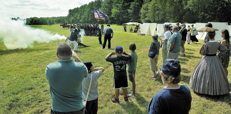Union forces wait for a cannon shot before going into battle Saturday during a Civl War re-enactment at Good Will-Hinckley. Events, which are open to the public, continue Sunday from 9 a.m. to 2 p.m.