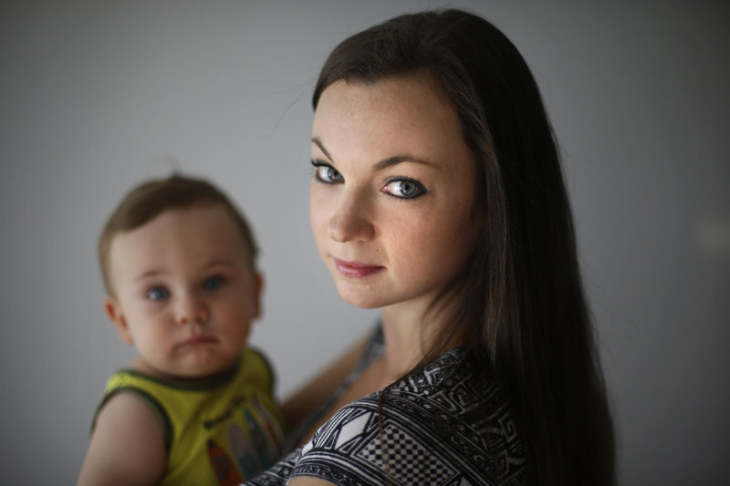 Philadelphia social worker Shannon Coyne poses for a portrait with her 11-month-old son. Coyne and her husband decided against circumcision for their son, because she didn't want him to have what she considers cosmetic surgery without being able to consent.