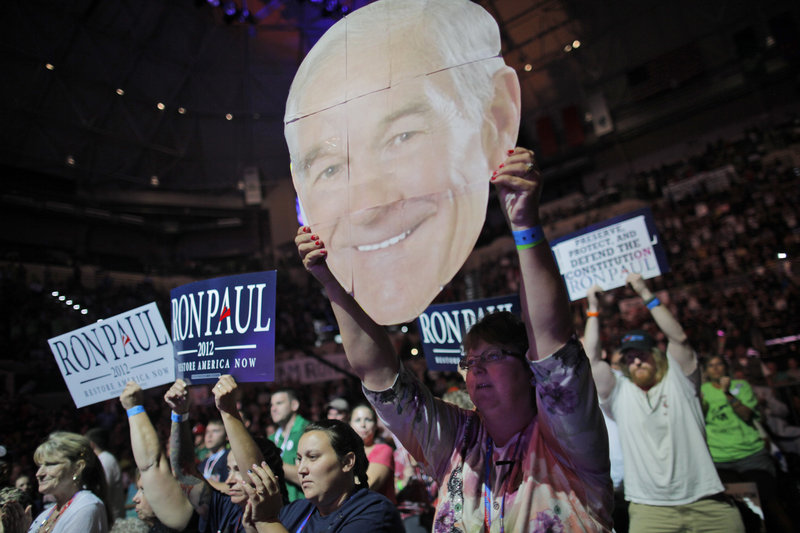 Mary White of Rathdrum, Idaho, shows her support for Rep. Ron Paul, R-Texas, at a rally at the University of South Florida Sun Dome on the sidelines of the Republican National Convention in Tampa, Fla., on Sunday.