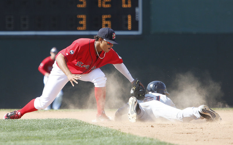 Xander Bogaerts tags out Binghamton’s Eric Campbell on a stolen-base attempt. Sea Dogs catcher Christian Vazquez threw out two base stealers, and has caught more than 40 percent of opposing base stealers this season in 91 total games in high Class A and Double-A.