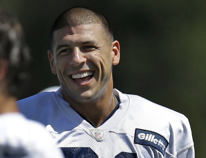 New England Patriots tight end Aaron Hernandez laughs at team practice in Foxborough, Mass., on Monday. The Patriots are preparing for their final pre-season football game against the New York Giants on Wednesday.