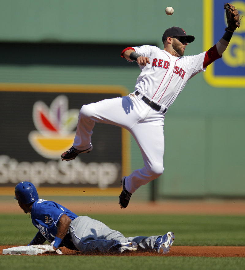 Dustin Pedroia can’t catch a throw from Jarrod Saltalamacchia as Jarrod Dyson of the Royals steals second base in the first inning, setting up the only run allowed by Daisuke Matsuzaka in Boston’s 5-1 win.