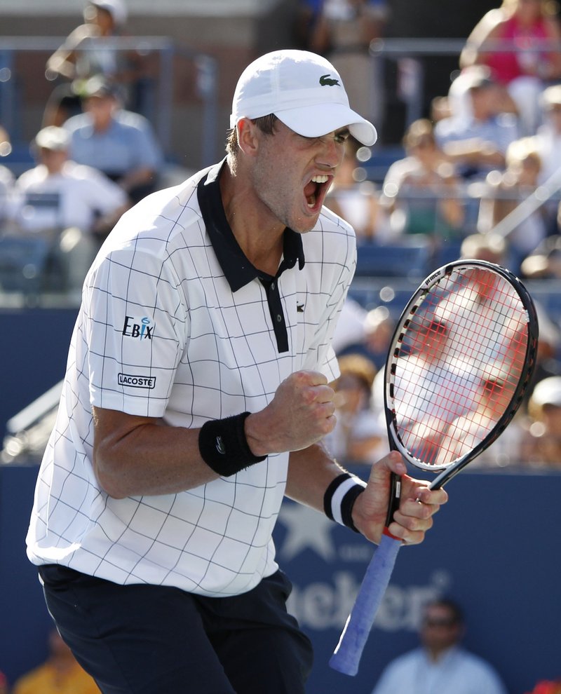 John Isner, at ninth the highest-ranked American man in the U.S. Open, got past Xavier Malisse in four sets in a first-round match Wednesday in New York.