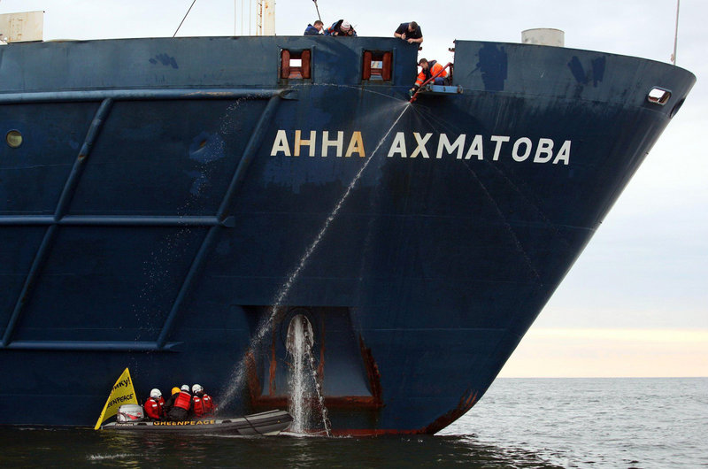 Greenpeace activists are chained Monday to the anchor chain of a ship carrying Gazprom workers to a drilling platform in the Pechora Sea. Gazprom is pioneering Russia’s oil drilling in the Arctic, but activists say drilling could be disastrous.
