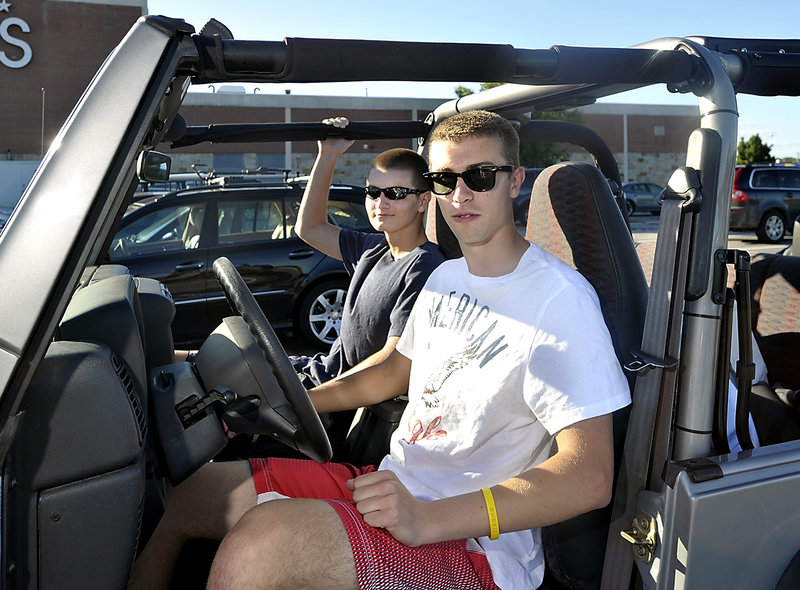 Portland High senior Bobby Parent, 18, right, says there’s a lot of peer pressure for friends to all ride together in the same car. His passenger, Chris Tomascak, 17, says “if it’s saving people from doing stupid things, I guess it’s good.” Tomascak goes for his driver’s license next month.