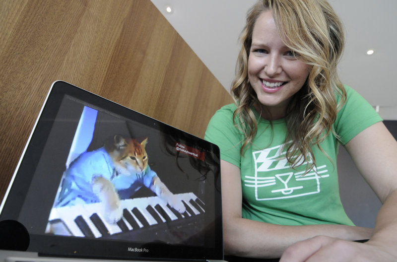 Katie Hill, a program associate with the Walker Art Center n Minneapolis shows a frame from a video of a cat playing the piano. The Walker will present its first “Internet Cat Video Film Festival” to showcase the best in filmed feline hijinks.