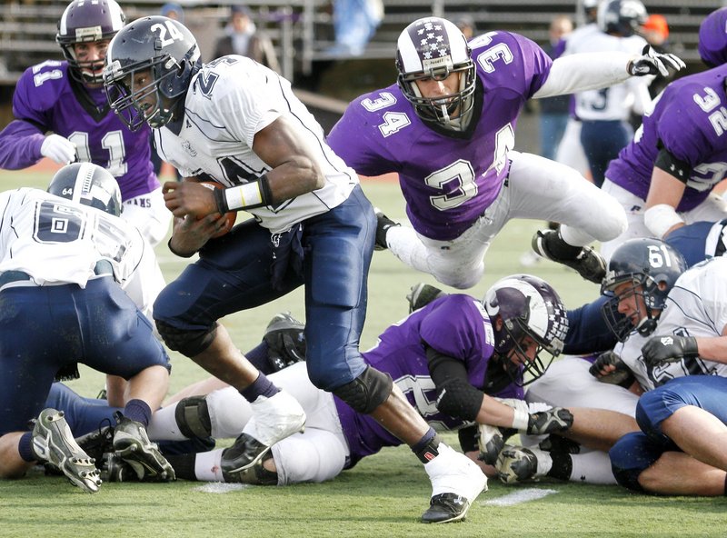 Kenny Sweet (34) of Deering is known for his defense but also figures to be a force at running back.