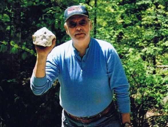 Kennebec Rocks & Minerals Club member Ron LePage poses with a softball-sized chunk of amethyst he discovered several years ago on a rock dig.