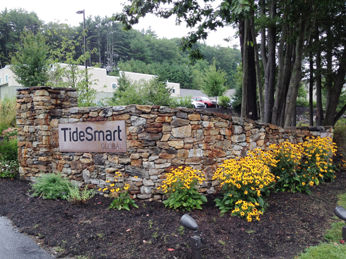 This is one of two stone-wall signs that flank the entrance to TideSmart Global, owned by Steve Woods, who is chairman of the Yarmouth Town Council and an independent candidate for U.S. Senate. Falmouth councilors agreed Monday night to seek a consent agreement and fine Woods because the stone-wall signs violate zoning regulations.