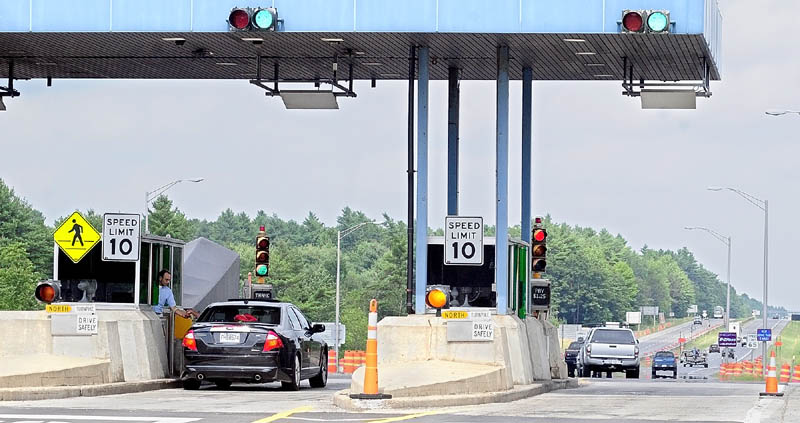 Vehicles go through the Mile 101 toll plaza on the Maine Turnpike (Interstate 95) on Thursday in West Gardiner. Under a toll increase proposal tentatively adopted by Maine Turnpike Authority's board Thursday the toll there would go up 50 cents from $1.25 to $1.75.