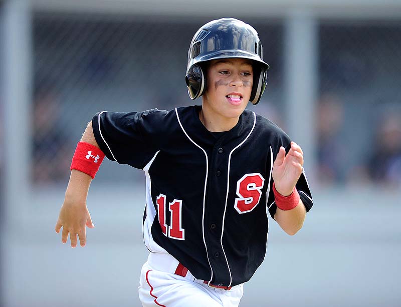 Scarborough Maine's Ogdan Timpson heads to first with a walk during a 1-0 loss to Rhode Island Sunday morning in Bristol, Conn., in the New England Regional Little League tournament.