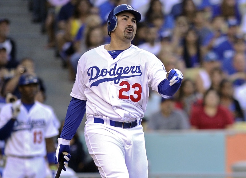 A familiar face in a new uniform got off to a can’t-top-this start Saturday night. Adrian Gonzalez of the, yes, Los Angeles Dodgers, hit a three-run homer in his first at-bat with his new team, right after stepping off a cross-country flight.