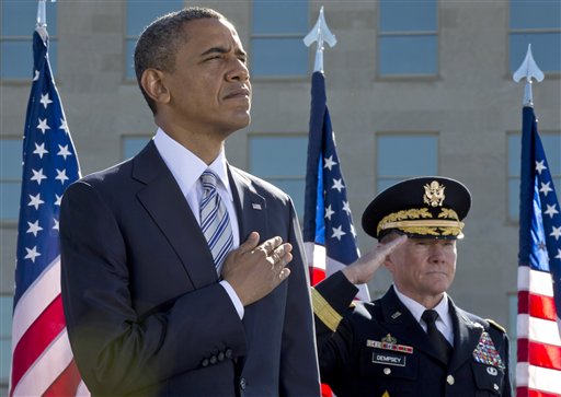 President Barack Obama and Joint Chiefs Chairman Gen. Martin Dempsey participate in a ceremony at the Pentagon Memorial,Tuesday, Sept. 11, 2012, to mark the 11th anniversary of the 9/11 attacks. (AP Photo/Carolyn Kaster)