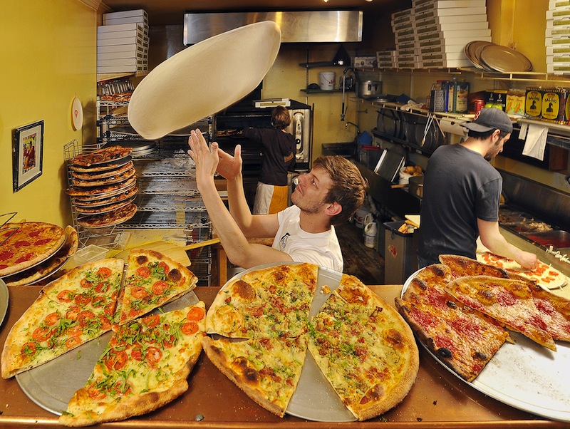 In this May 2011 file photo, Travis Curran of Otto Pizza tosses pizza pies as Nick Belkas adds the special eclectic toppings that attracted the attention of the Food Network. Otto is one of many restaurants that failed a recent health inspection by Portland, but it passed its follow-up inspection, unlike many others.