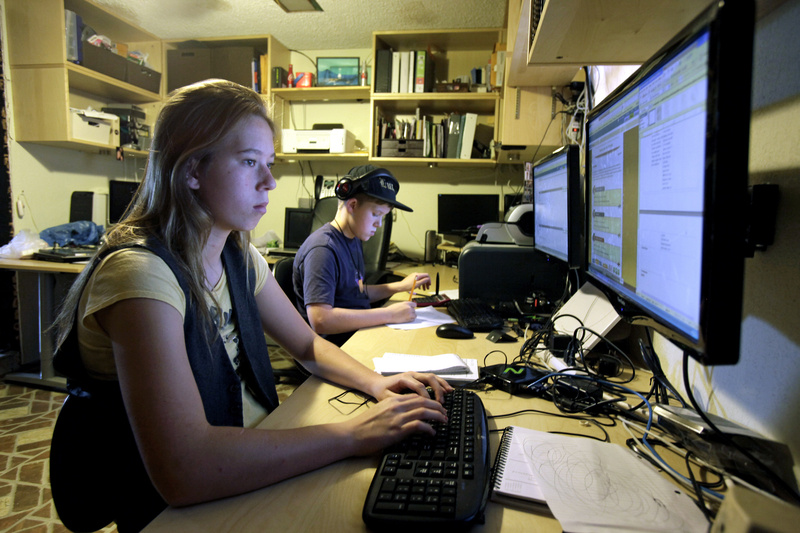 Celestial McBride, left, 14, and her brother Sevan, 12, work on an online lesson from the Florida Virtual School at their home in Mims, Fla., in 2011. A Maine Sunday Telegram investigation shows that companies that sell materials to online educators contribute to the election efforts of Gov. LePage and other candidates and have undue influence on state policy.