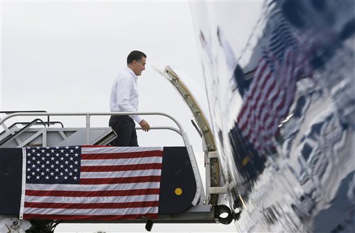 Republican presidential candidate and former Massachusetts Gov. Mitt Romney boards his campaign charter plane in West Palm Beach, Fla., Friday, Sept. 21, 2012. (AP Photo/Charles Dharapak)