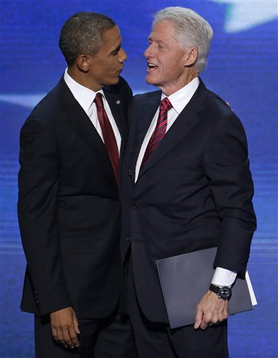 Former President Bill Clinton talks with President Barack Obama after Clinton's speech to the Democratic National Convention in Charlotte, N.C., on Wednesday, Sept. 5, 2012. (AP Photo/J. Scott Applewhite)