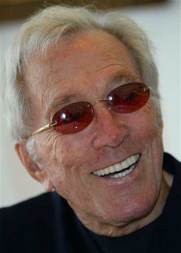 FILE - In this July 25, 2004 file photo, U.S. singer Andy Williams smiles as he speaks to reporters during his news conference at a Tokyo hotel. Emmy-winning TV host and "Moon River" crooner Williams died Tuesday night, Sept, 25, 2012 at his home in Branson, Mo., following a year-long battle with bladder cancer. He was 84. (AP Photo/Shizuo Kambayashi, File)