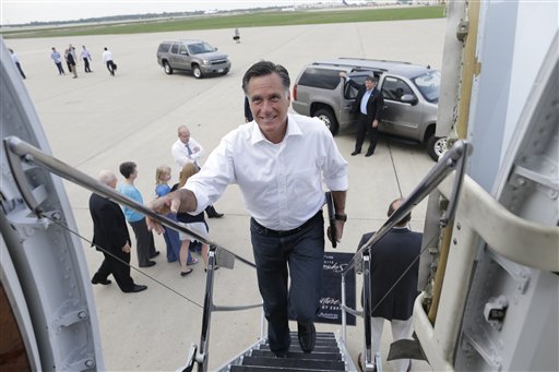 Republican presidential candidate and former Massachusetts Gov. Mitt Romney boards his campaign charter plane in Kansas City, Missouri, after a refueling as he travels to Los Angeles, Calif., Mass., Sunday, Sept. 16, 2012. (AP Photo/Charles Dharapak)