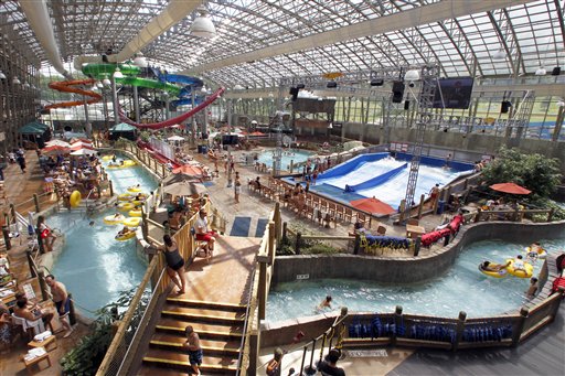 In this Aug. 8, 2012 photo, people enjoy the Jay Peak Pump House indoor waterpark in Jay, Vt. Guests at Northern New England ski resorts are still enjoying waterparks and zip lines, but after a dismal, snowless winter, owners are looking ahead and trying to lock in skiers to season passes for the coming season. (AP Photo/Toby Talbot)