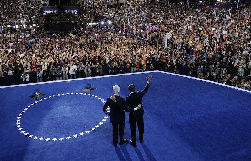 President Barack Obama, right, and former President Bill Clinton wave to delegates after Clinton's speech to the Democratic National Convention in Charlotte, N.C., on Wednesday, Sept. 5, 2012. (AP Photo/Charlie Neibergall)