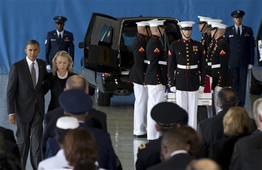 President Barack Obama and Secretary of State Hillary Rodham Clinton walk back to their seats after speaking during the Transfer of Remains Ceremony on Friday at Andrews Air Force Base, Md., marking the return to the United States of the remains of the four Americans killed this week in Benghazi, Libya.