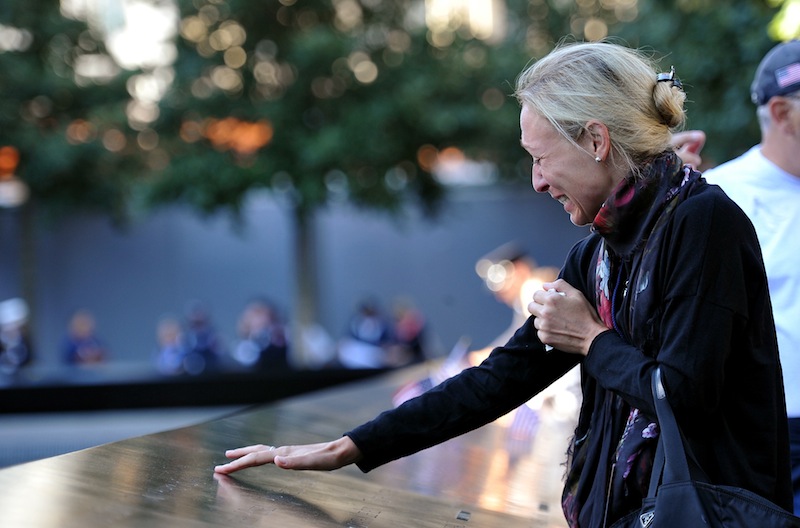 Carrie Bergonia remembers her fiancee, firefighter Joseph Ogren, who was killed in the terrorist attacks of Sept. 11, 2001, during a ceremony marking the 11th anniversary of the attacks at the National September 11 Memorial at the World Trade Center site in New York, Tuesday, Sept. 11, 2012. (AP Photo/The Daily News, Todd Maisel, Pool)