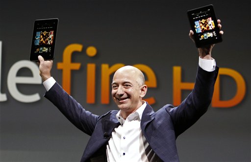 Jeff Bezos, CEO and founder of Amazon, holds the new Kindle Fire HDs in Santa Monica, Calif., on Thursday.