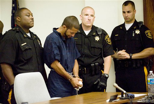 Osvaldo Rivera, 31, of Camden, N.J., accused of killing a 6-year-old boy while high on PCP-laced marijuana, sobs during his arraignment at Camden County Superior Court in Camden, N.J. on Tuesday. Prosecutors say Rivera slashed the throat of the boy, who was trying to save his sister as she was being assaulted on the floor during a middle-of-the-night attack Sunday.