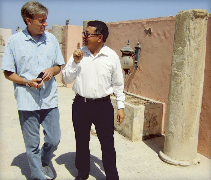U.S. Ambassador Christopher Stevens, left, walks with an unidentified translator last month in Tripoli, Libya. Stevens served as emissary to Libyan rebels when they were fighting to oust Moammar Gadhafi.