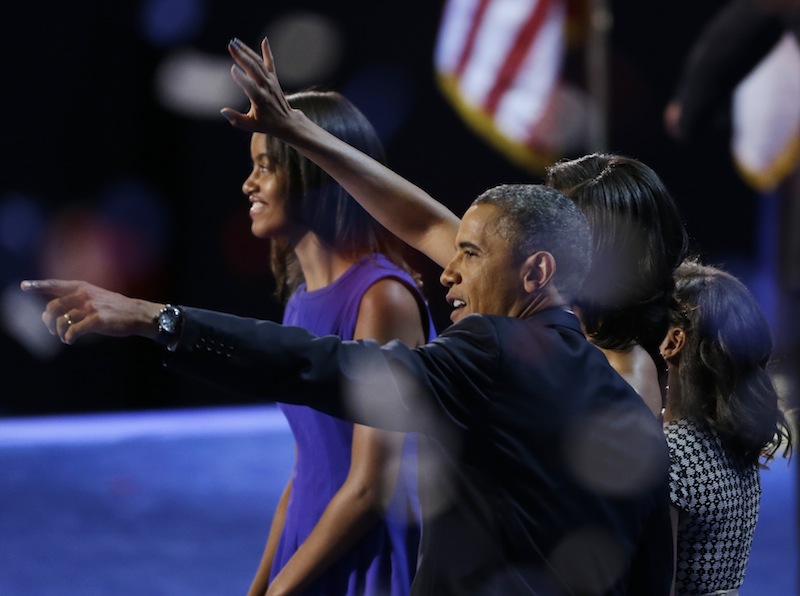 President Barack Obama waves with his wife Michelle and his daughters Malia and Sasha after his speech to the Democratic National Convention in Charlotte, N.C., on Thursday, Sept. 6, 2012. (AP Photo/Lynne Sladky)