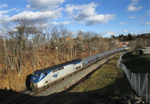 In this Dec. 8, 2011 file photo, the Amtrak Downeaster passenger train travels through Portland, Maine. (AP Photo/Robert F. Bukaty)