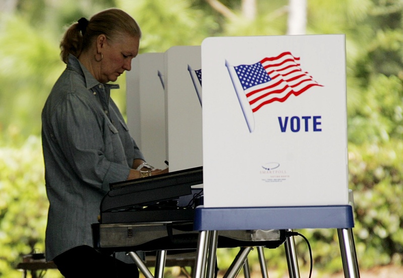 A woman votes at a fire station in Jupiter, Fla., on Nov. 4, 2008. The Republican Party of Florida has fired a get-out-the-vote firm after learning of questionable new voter registrations submitted in at least 10 Florida counties.