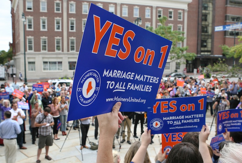 Gay marriage supporters gather Monday Sept. 10, 2012 at a rally outside of City Hall in Portland, Maine, in support of an upcoming ballot question that seeks to legalize same-sex marriage. (AP Photo/Joel Page)